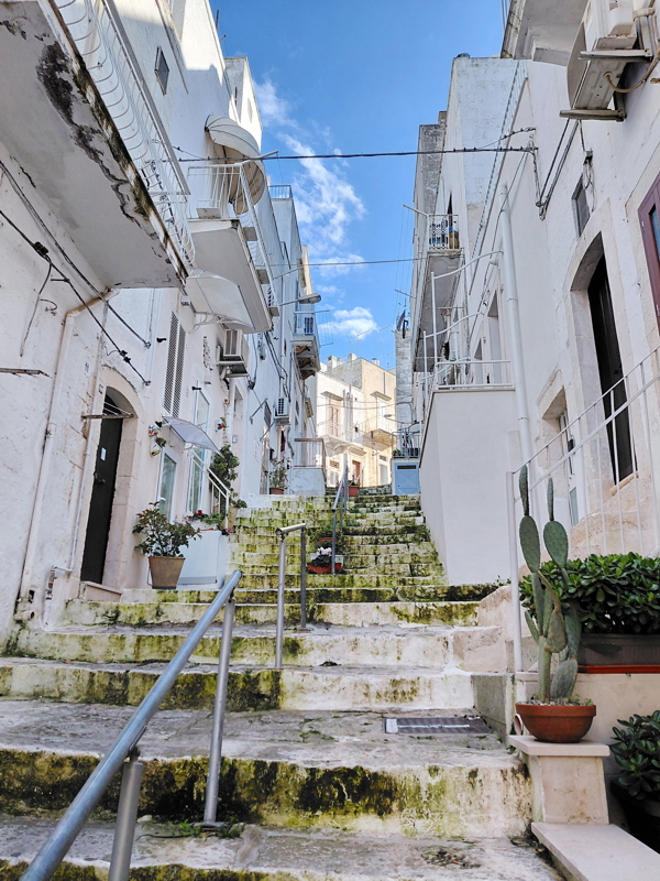 Narrow, whitewashed street in Ostuni, Italy
